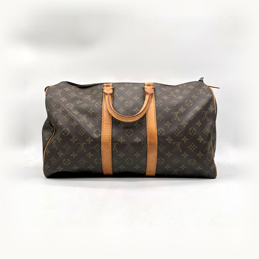 Louis Vuitton Keepall 45 Lona Monogram - vista frontal, pegas e faixa em pele natural