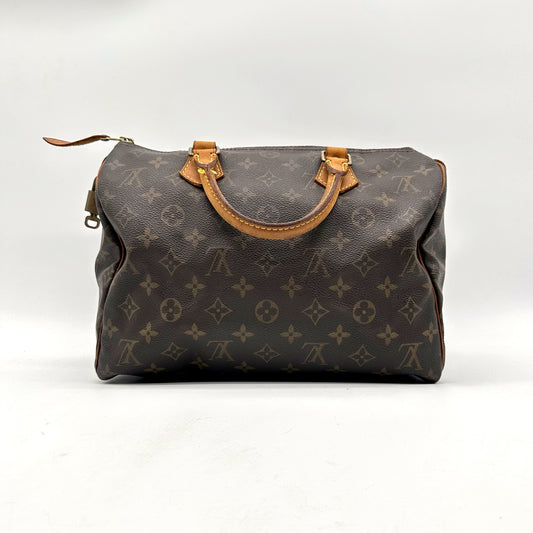 Louis Vuitton Speedy 30 Toile Monogram - vue de face opposée, sac posé