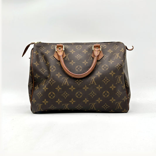 Louis Vuitton Speedy 30 Lona Monogram - vista frontal oposta, mala pousada