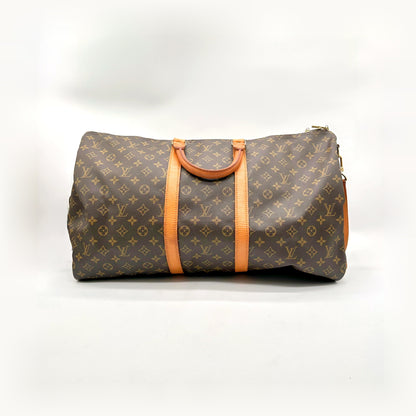 Louis Vuitton Keepall Bandoulière 55 Toile Monogram - vue de face, anses et bande de cuir naturel