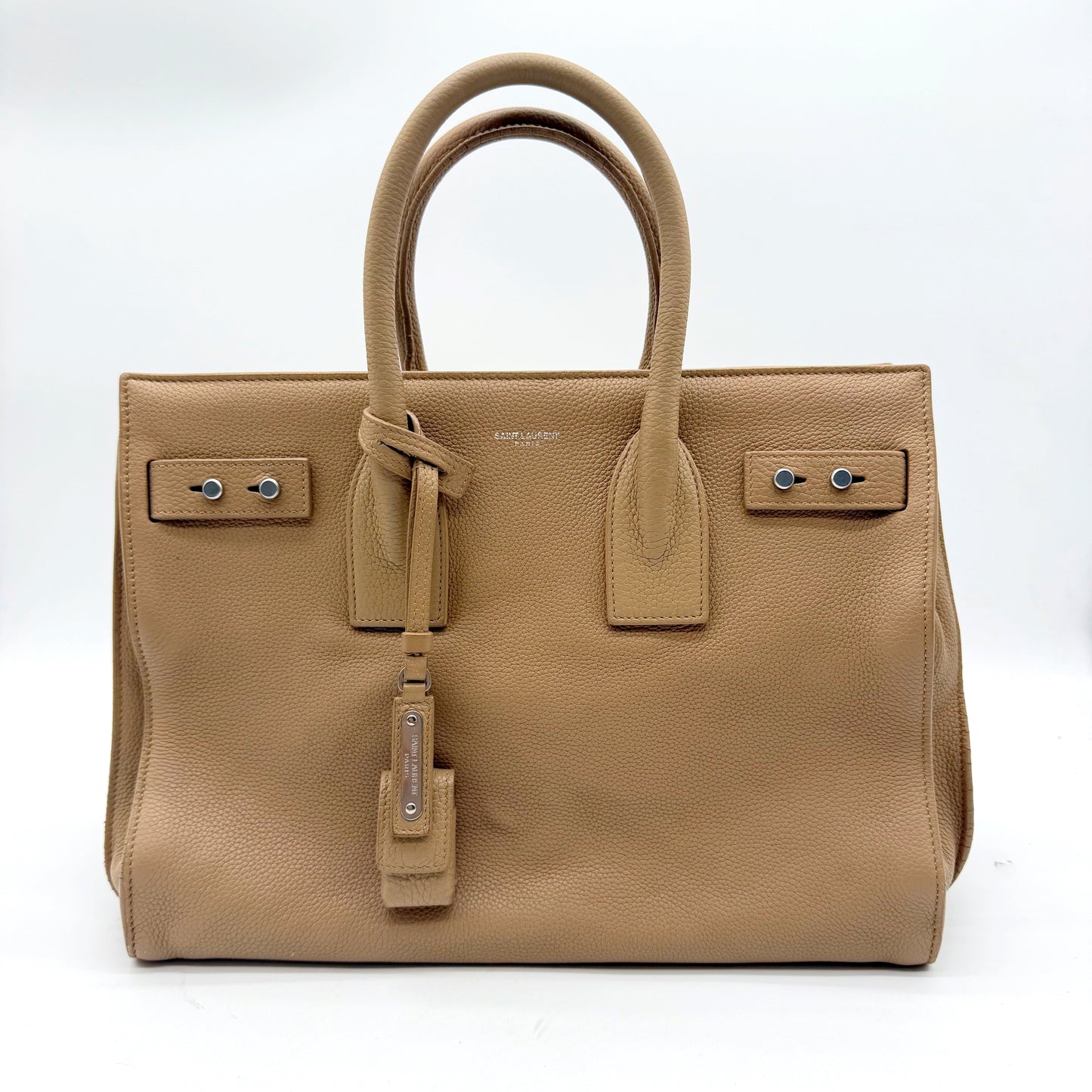 Saint Laurent Sac de Jour cuir grainé beige - face avant avec clochette et cadenas