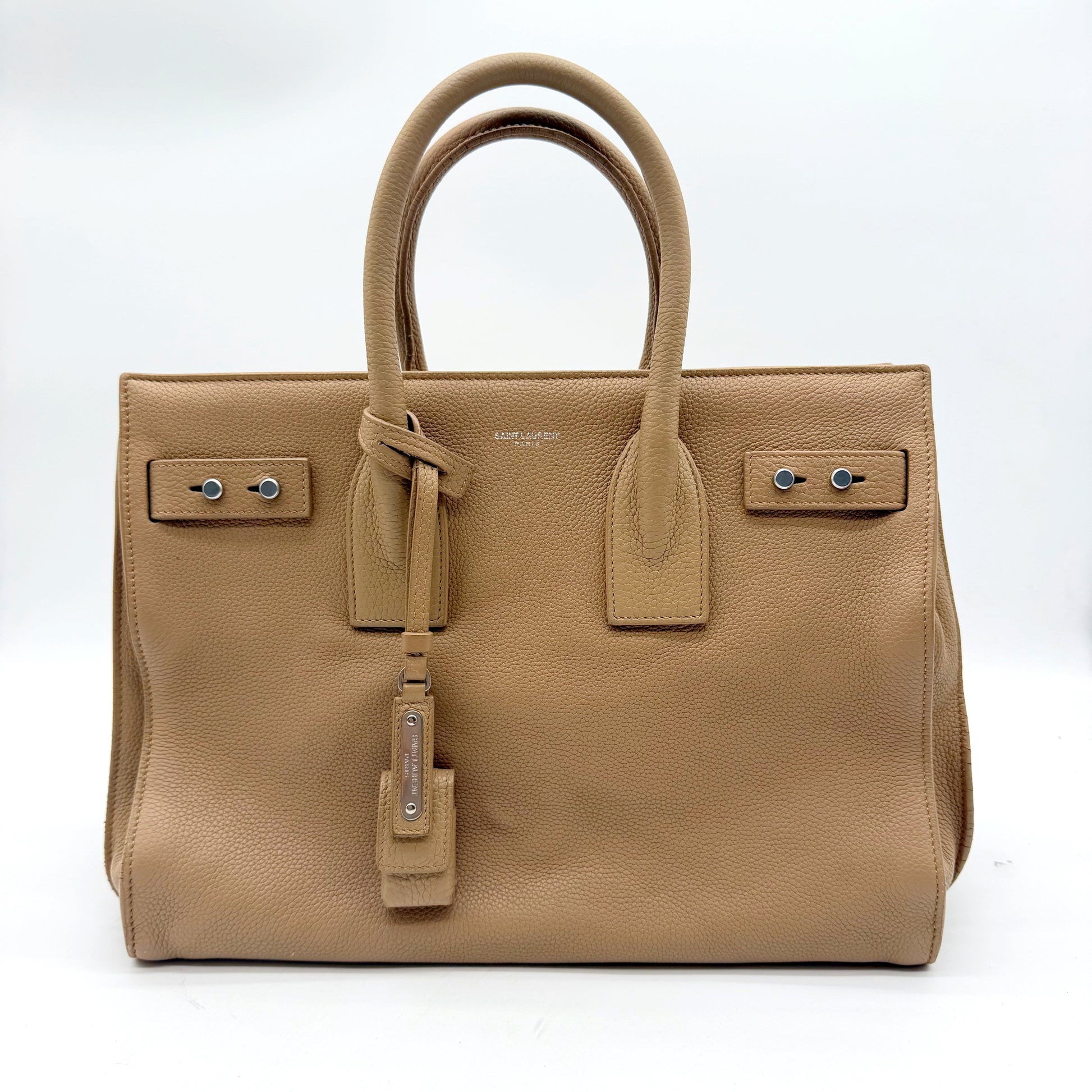 Saint Laurent Sac de Jour cuir grainé beige - face avant avec clochette et cadenas