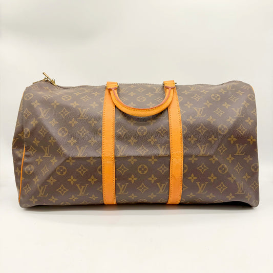Louis Vuitton Keepall 50 toile Monogram - face avant avec poignées en cuir naturel