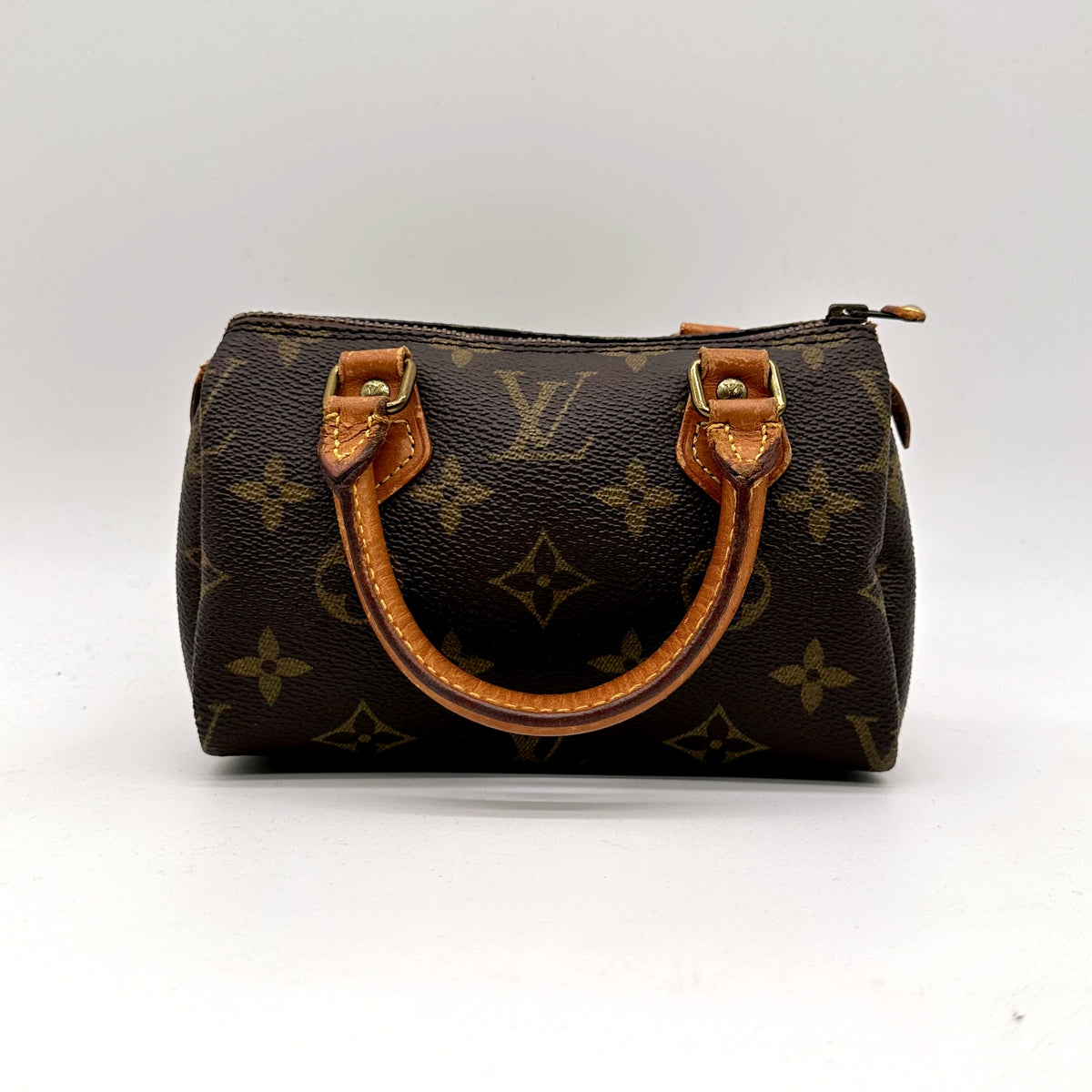 Louis Vuitton Nano Speedy Toile Monogram - vue de face, anses en cuir naturel