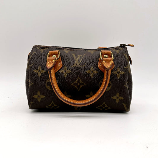 Louis Vuitton Nano Speedy Toile Monogram - vue de face, anses en cuir naturel