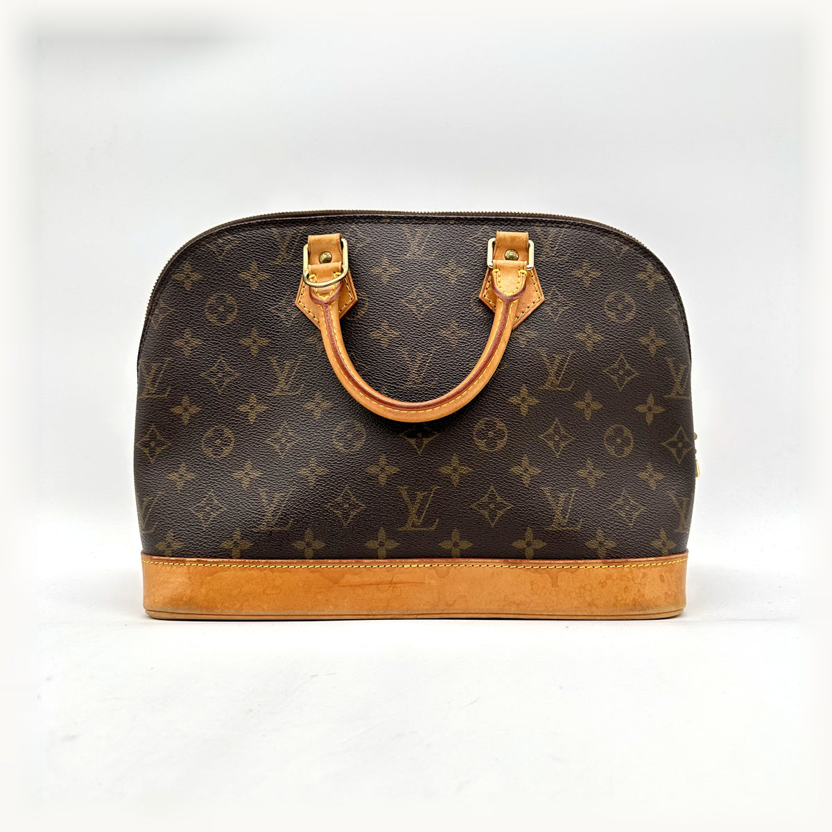 Louis Vuitton Alma Toile Monogram - vue de face, anses et base en cuir naturel