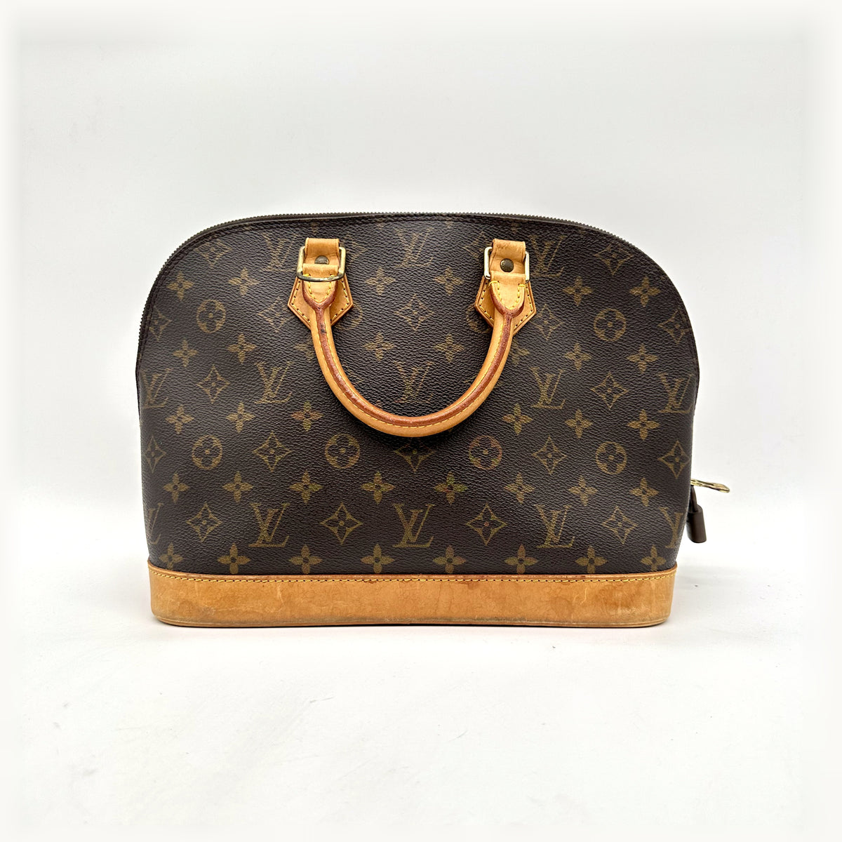 Louis Vuitton Alma Toile Monogram - vue de face, anses et base en cuir naturel