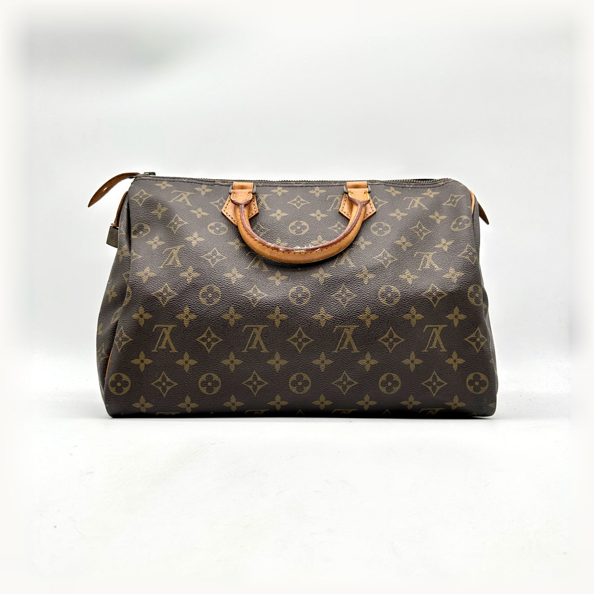Louis Vuitton Speedy 35 Toile Monogram - vue de face, anses en cuir naturel