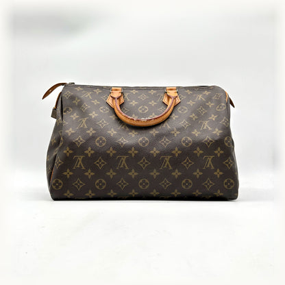 Louis Vuitton Speedy 35 Toile Monogram - vue de face, anses en cuir naturel