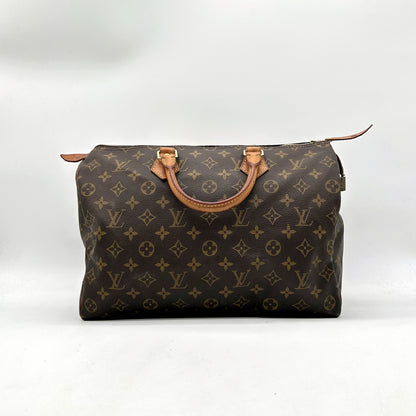 Louis Vuitton Speedy 30 Toile Monogram - vue de face, anses en cuir naturel