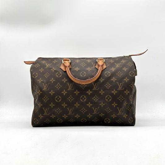 Louis Vuitton Speedy 30 Toile Monogram - vue de face, anses en cuir naturel