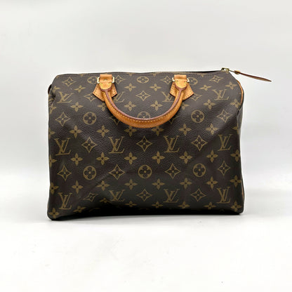 Louis Vuitton Speedy 30 Toile Monogram - vue de face, anses en cuir naturel