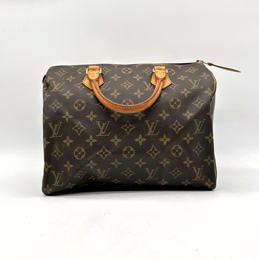 Louis Vuitton Speedy 30 Toile Monogram - vue de face, anses en cuir naturel
