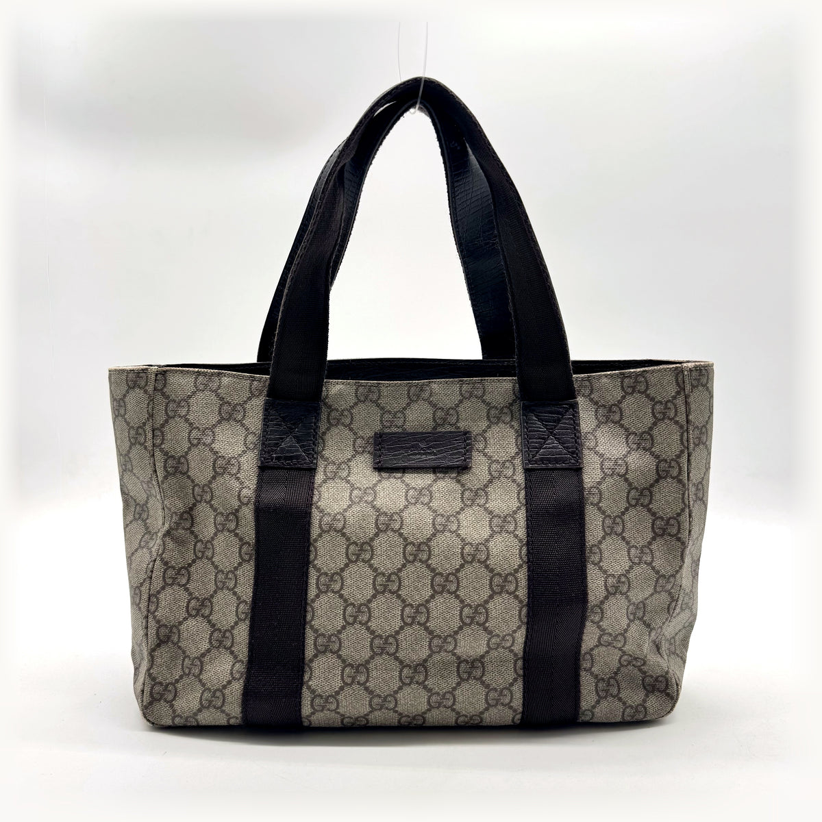 Gucci Tote Toile GG Beige et Cuir Brun - vue de face, anses et plaque de cuir