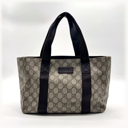 Gucci Tote Toile GG Beige et Cuir Brun - vue de face, anses et plaque de cuir