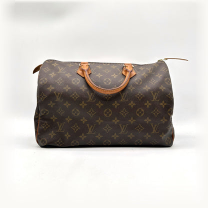 Louis Vuitton Speedy 35 Toile Monogram - vue de face, anses en cuir naturel