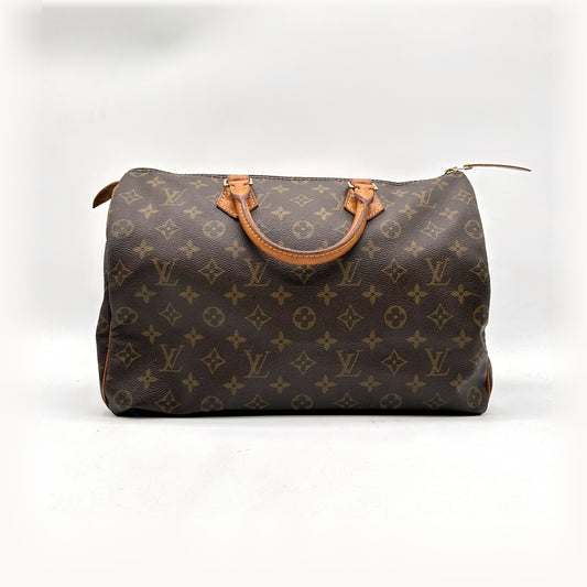Louis Vuitton Speedy 35 Toile Monogram - vue de face, anses en cuir naturel