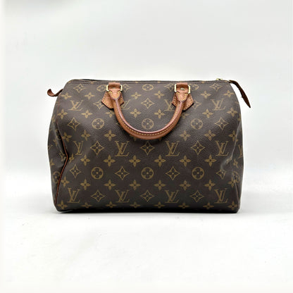 Louis Vuitton Speedy 30 Toile Monogram - vue de face, anses en cuir naturel