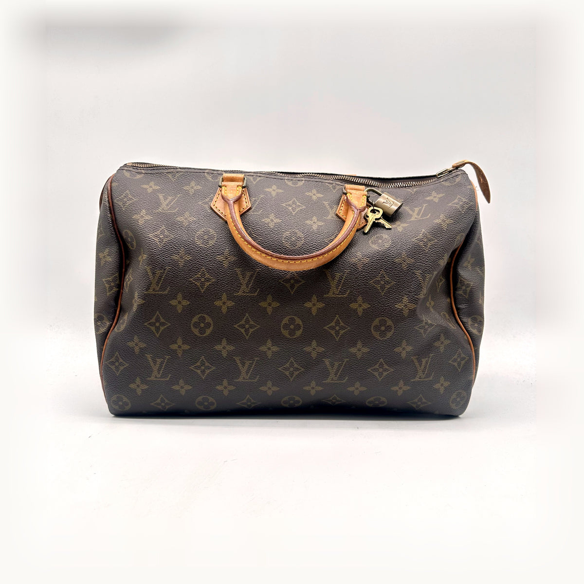 Louis Vuitton Speedy 35 Toile Monogram - vue de face, anses et cadenas
