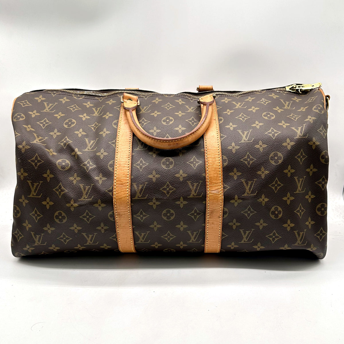 Louis Vuitton Keepall 50 Bandoulière Toile Monogram - vue de face, anses et bande de cuir