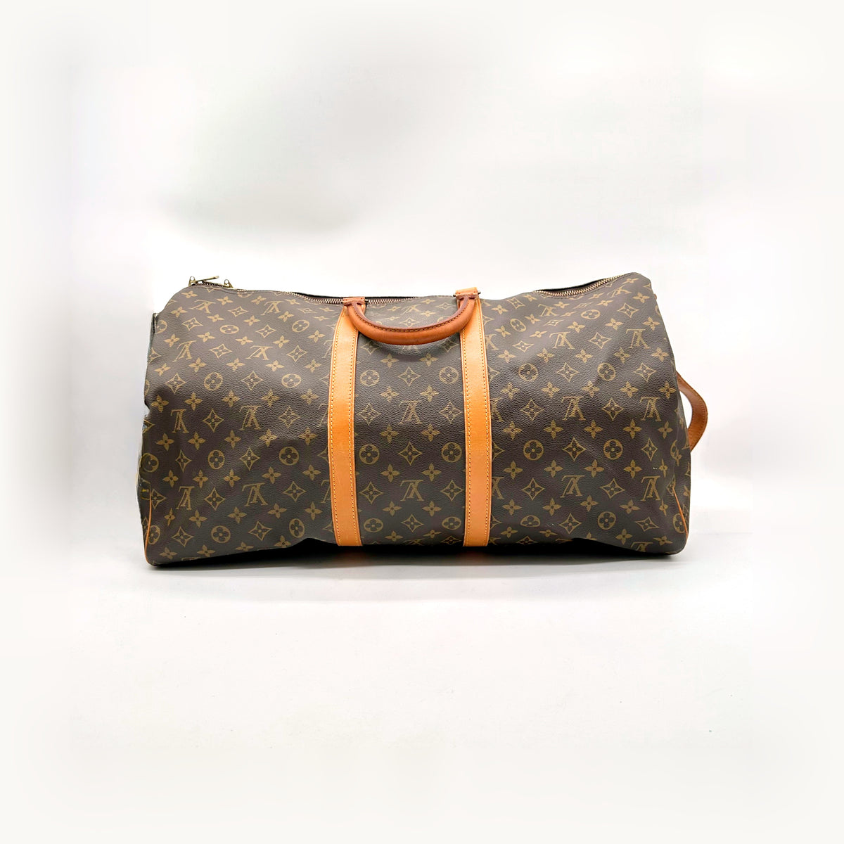 Louis Vuitton Keepall Bandoulière 55 Toile Monogram - vue de face avec la bandoulière posée derrière