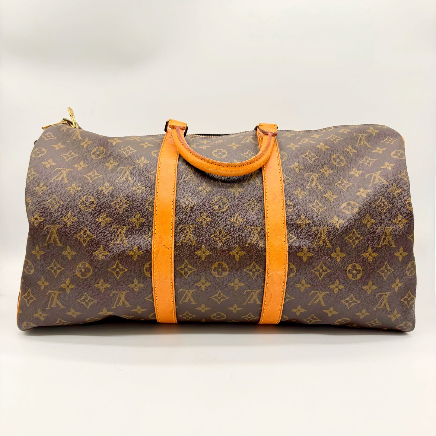 Louis Vuitton Keepall Bandoulière 50 en toile Monogram, face arrière et poignées en cuir naturel