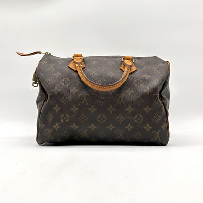 Louis Vuitton Speedy 30 Toile Monogram - vue de face opposée, sac posé