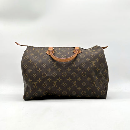 Louis Vuitton Speedy 30 Toile Monogram - vue de face opposée, sac posé