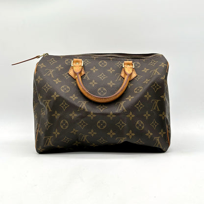 Louis Vuitton Speedy 30 Toile Monogram - vue de face opposée, sac posé