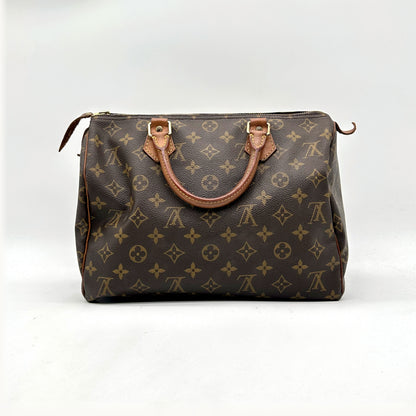 Louis Vuitton Speedy 30 Toile Monogram - vue de face opposée, sac posé