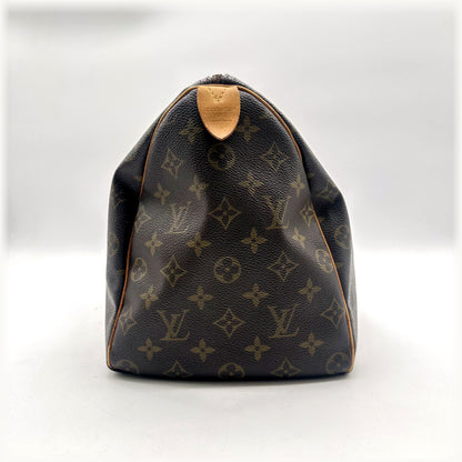 Louis Vuitton Speedy 30 Toile Monogram - côté opposé avec patte en cuir naturel