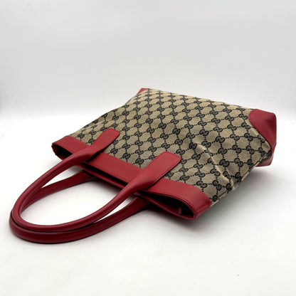 Gucci Tote Lona GG y Piel Roja - bolso apoyado en plano, lona GG y asas