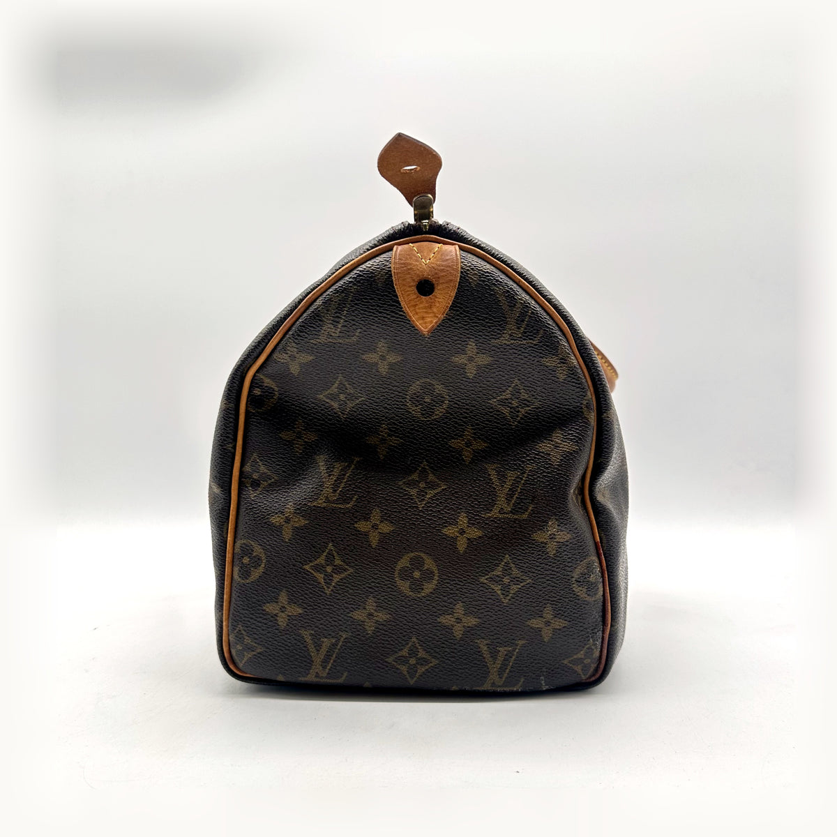 Louis Vuitton Speedy 30 Toile Monogram - côté opposé avec patte en cuir naturel