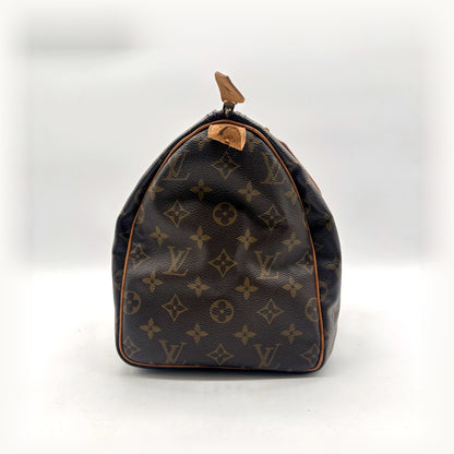 Louis Vuitton Speedy 30 Toile Monogram - côté opposé avec patte en cuir naturel