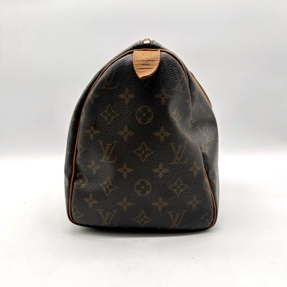 Louis Vuitton Speedy 30 Toile Monogram - côté opposé avec patte en cuir naturel