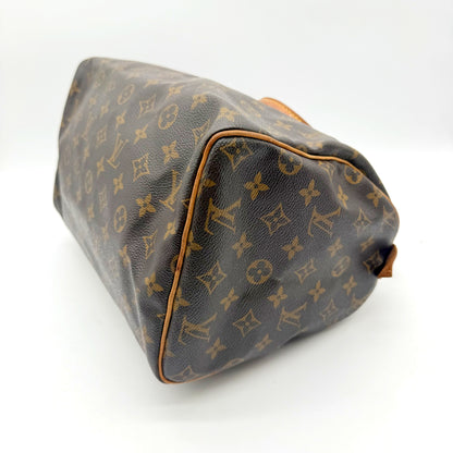 Louis Vuitton Speedy 30 toile Monogram - base et angles, passepoil en cuir