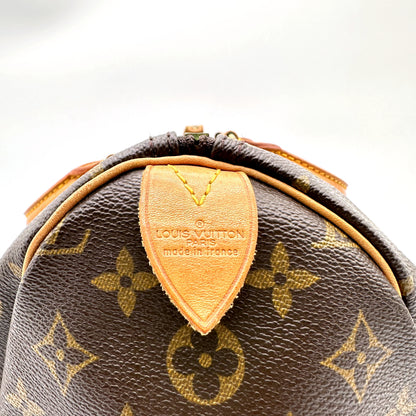 Louis Vuitton Speedy 35 toile Monogram - patte de cuir centrale et haut du sac