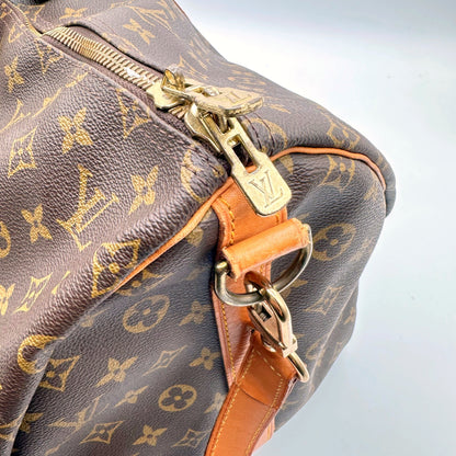 Louis Vuitton Keepall Bandoulière 55 Toile Monogram - détail du zip, du double curseur et de l'attache de bandoulière