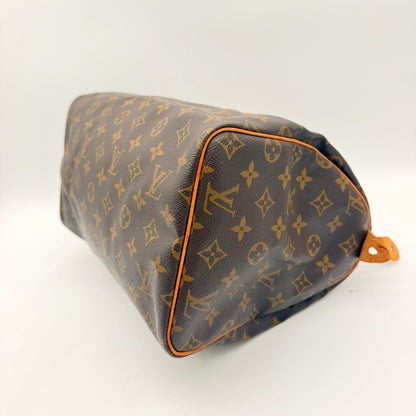 Louis Vuitton Speedy 30 toile Monogram - base et coin en trois quarts