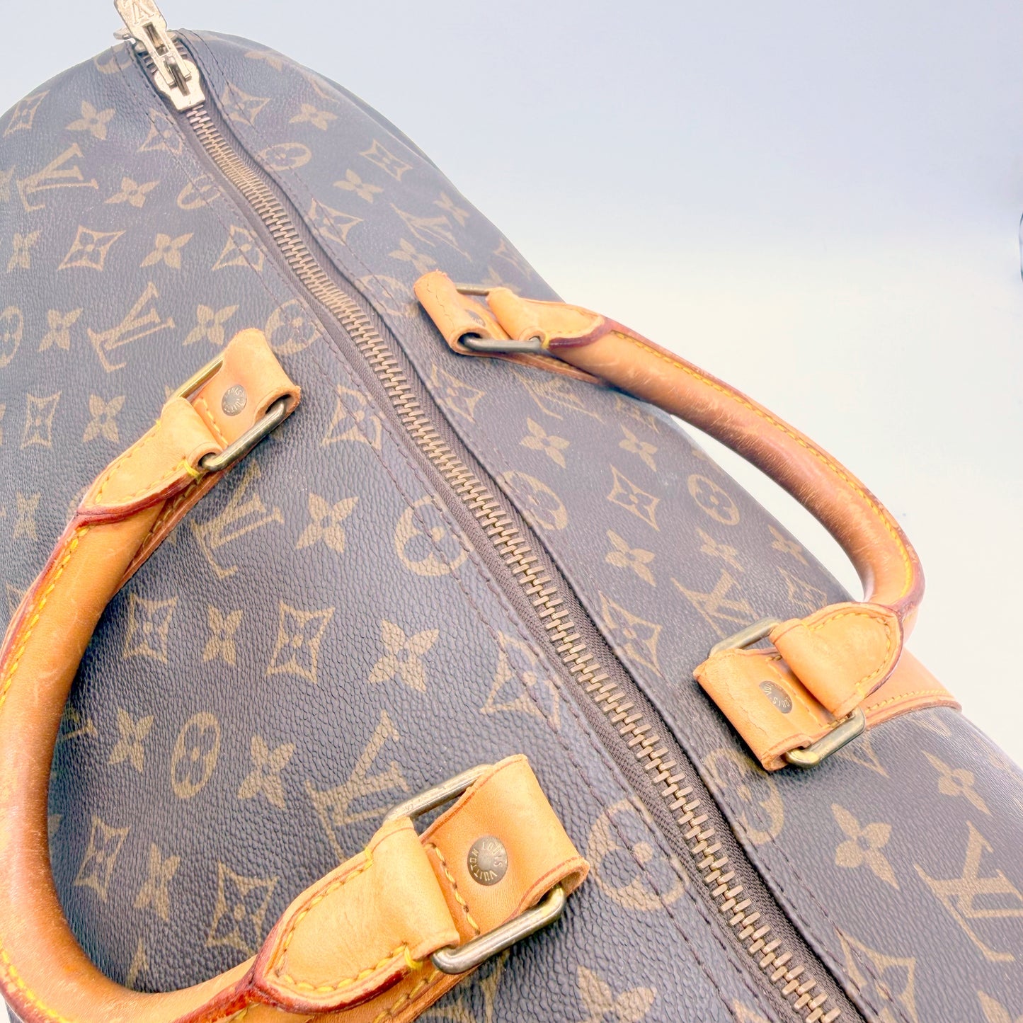 Louis Vuitton Keepall 50 toile Monogram - attaches des poignées et fermeture éclair