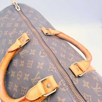 Louis Vuitton Keepall 50 toile Monogram - attaches des poignées et fermeture éclair