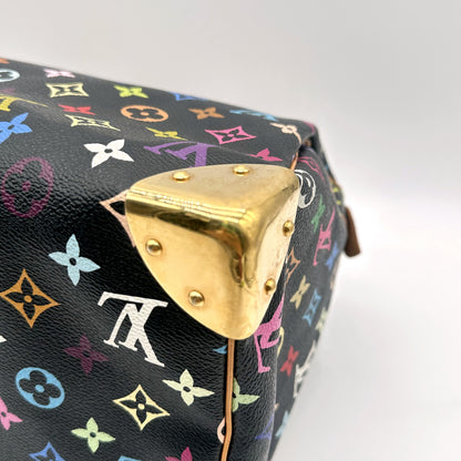 Louis Vuitton Speedy 30 Toile Monogram Multicolore Noir - détail d'un coin doré et de la toile