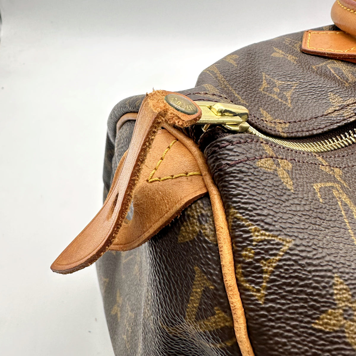 Louis Vuitton Speedy 40 Toile Monogram - détail du zip et de la déchirure de la bande de toile