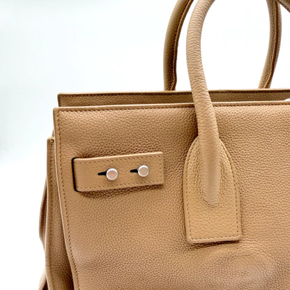 Saint Laurent Sac de Jour cuir grainé beige - attache d'anse et patte à boutons-pression