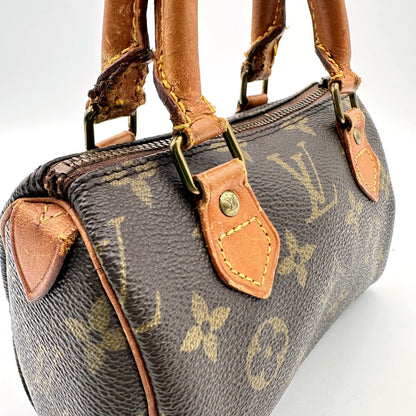 Louis Vuitton Nano Speedy Toile Monogram - détail des anses et de leurs attaches