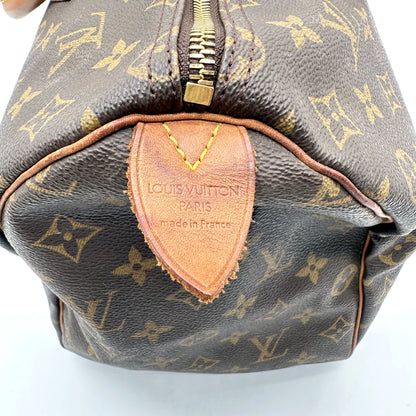 Louis Vuitton Speedy 30 Toile Monogram - détail de la patte de cuir d'extrémité
