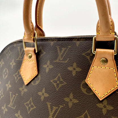 Louis Vuitton Alma Toile Monogram - détail des anses et de leurs attaches