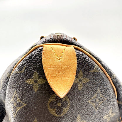 Louis Vuitton Speedy 30 Toile Monogram - détail de la patte latérale en cuir naturel