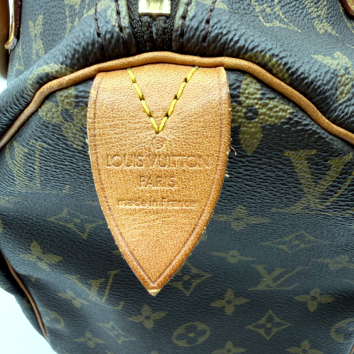 Louis Vuitton Speedy 30 toile Monogram - patte de cuir centrale et haut du zip