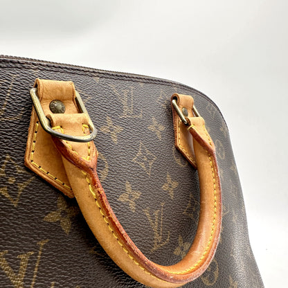 Louis Vuitton Alma Toile Monogram - détail d'une anse et de son point d'attache